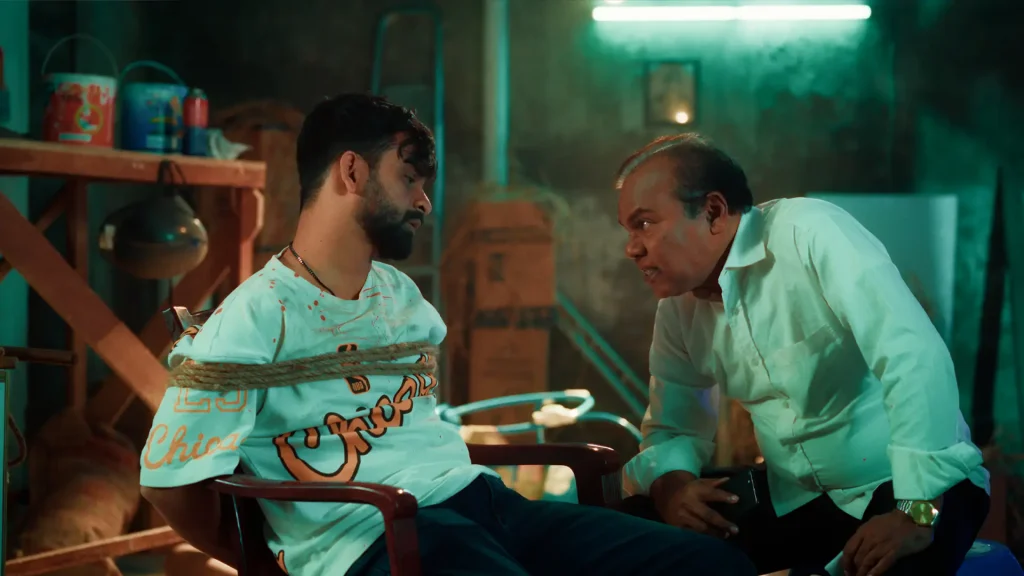 Fazlur Rahman Babu confronts a bearded man tied to a chair in the Bangla Full Natok Sei Ami Nei Ami.